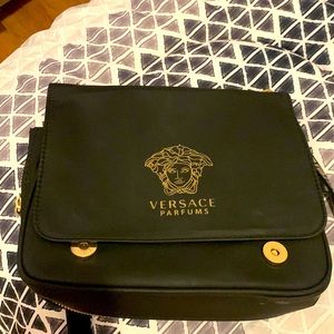 Versace crossbody bag used it a lot very comfortable. Still life left.